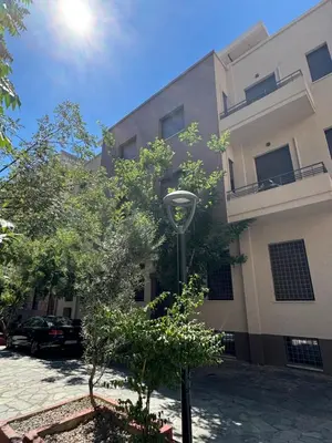 a building with a street light in front of it at Kozy Koala Apartments n22 in Athens
