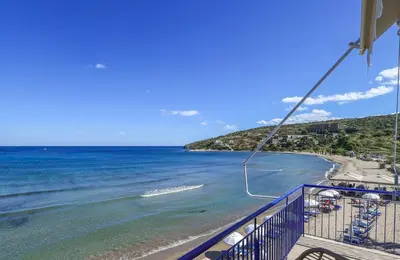 a view of the beach from a cruise ship at Niko's Beach Suites No1 in Agia Marina Aegina