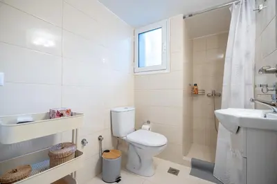 a bathroom with a toilet and a sink and a shower at kato patisia cozy apartment for 2 persons by MPS in Athens