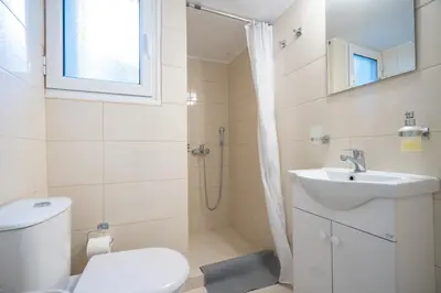 a bathroom with a toilet and a sink and a shower at kato patisia cozy apartment for 2 persons by MPS in Athens