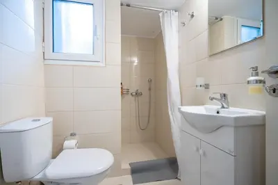 a bathroom with a toilet and a sink at kato patisia cozy apartment for 2 persons by MPS in Athens
