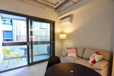 a living room with a couch and a table at Athens loft 5 min from Monastiraki metro stop in Athens