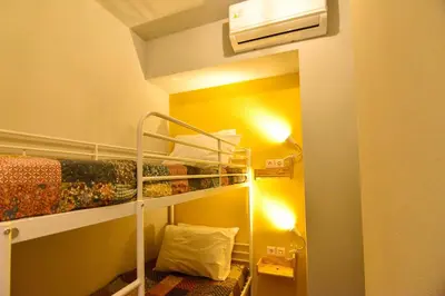 a small room with a bunk bed in a room at Athens loft 5 min from Monastiraki metro stop in Athens
