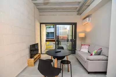 a living room with a table and a couch at Athens loft 5 min from Monastiraki metro stop in Athens