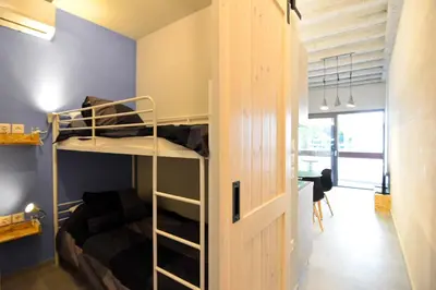 a room with a bunk bed and a desk at Athens industrial design apt 5 min from Metro in Athens
