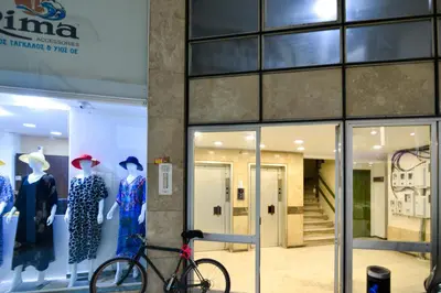 a bike parked in front of a store window at Athens industrial design apt 5 min from Metro in Athens