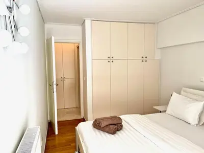 a bedroom with a bed with a towel on it at Pratinou 1B/R apartment in Athens