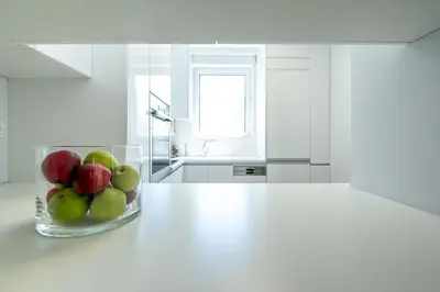 a bowl of apples sitting on a counter in a kitchen at Athens Riviera Aelia Luxury Suite By The Sea in Athens