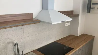 a kitchen with a counter top with a stove at 2BDR q in Athens