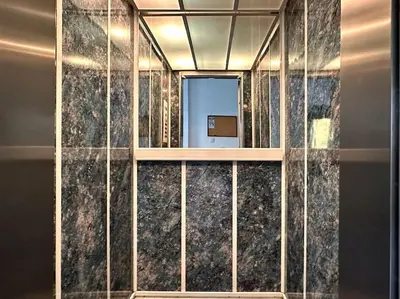 a lobby with marble walls and a glass wall at D150 Orange & New Life - Cloud9 in the city in Athens