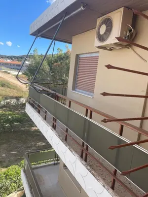 a view of the balcony of a house at Seaside Argo apartment in Porto Rafti