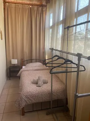 a bedroom with a bunk bed with two pillows at Seaside Argo apartment in Porto Rafti