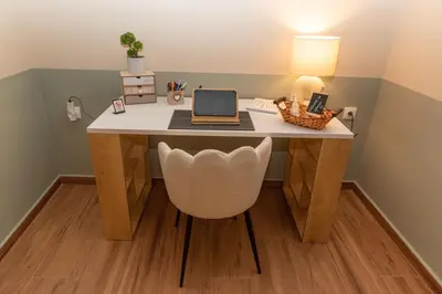 a desk with a laptop computer on top of it at Athena Cocooning Apartment in Piraeus