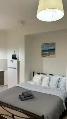 a bedroom with a bed with a towel on it at Apartment in Athens centre in Athens