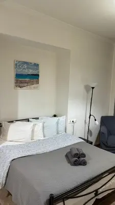 a bedroom with a bed with towels on it at Apartment in Athens centre in Athens