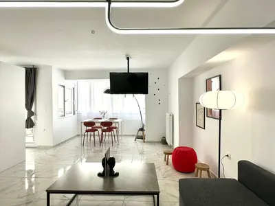 a living room with a couch and a table at Walk into Dream of Acropolis 10 in Athens