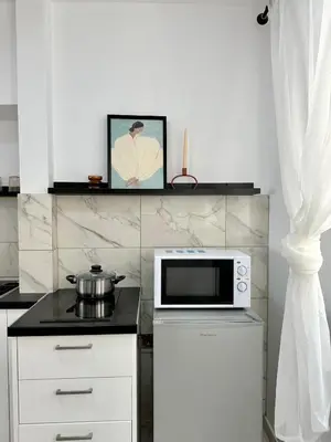 a kitchen with a microwave and a counter top at Walk into Dream of Acropolis 10 in Athens