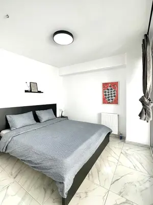 a bedroom with a bed in a white room at Walk into Dream of Acropolis 10 in Athens
