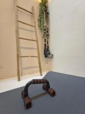 a exercise belt on the floor in a room with a ladder at Lindy S in Athens