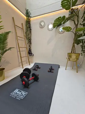 a pair of dumbbells laying on a floor in a room at Lindy S in Athens