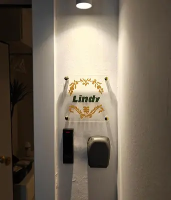 a door with a library sign on a wall at Lindy S in Athens
