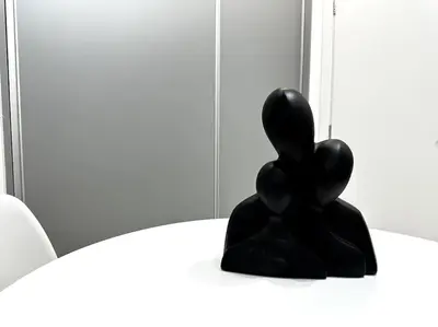 a sculpture of a person with balloons on a table at Cozy Elegant Apartment #2 VIPGreece in Athens