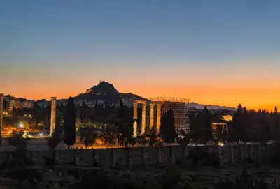 a view of the acropolis at sunset at Acropolis Compass Residence in Athens