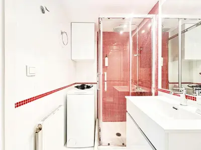a white bathroom with a shower and a sink at Pame Rentals - Chic Alimos Home, 5 Min Walk to the Beach in Athens