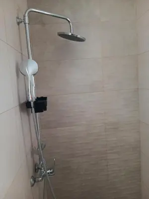 a shower with a shower head in a bathroom at Athens LUXURY STUDIO 1 in Athens
