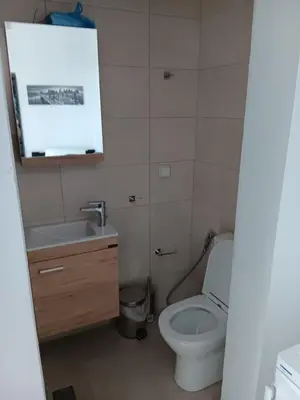 a small bathroom with a toilet and a sink at Athens LUXURY STUDIO 1 in Athens