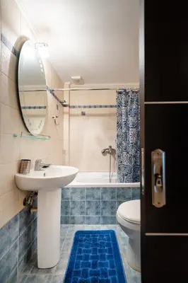 a bathroom with a sink and a tub and a toilet at Perfect House in Spata in Spáta