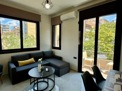 a living room with a couch and a table at Kozy Koala Apartments, n21, Near Akropolis in Athens