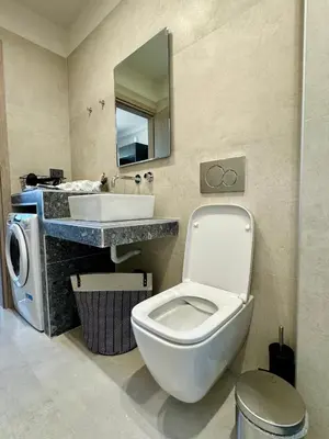 a bathroom with a toilet and a sink at Kozy Koala Apartments, n21, Near Akropolis in Athens