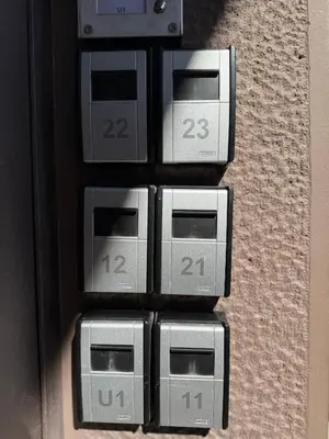a bunch of alarm clocks on a wall at Kozy Koala Apartments, n21, Near Akropolis in Athens