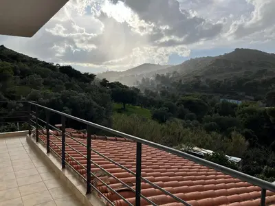 a balcony with a view of a mountain at Filoxenia Harmony Retreat in Keratea