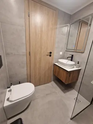 a bathroom with a toilet and a sink at Órrhaon Athens in Athens