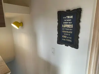 a sign hanging on a wall next to a door at Porto - luxury penthouse, pool, walk to the beach in Porto Rafti