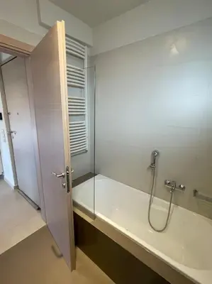 a bathroom with a shower with a glass wall at Porto - luxury penthouse, pool, walk to the beach in Porto Rafti