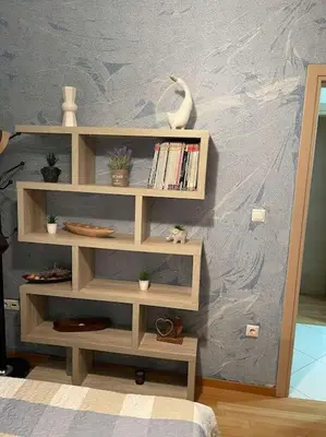 a book shelf with a swan on a wall at newly built apartment with amazing view in Athens