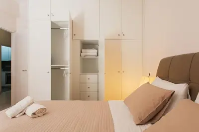 a bedroom with a bed with two towels on it at Flat in Athens historic city center @Ipitou str in Athens