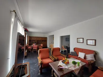 a living room with a couch and chairs and a table at Penthouse Anneliese in Athens