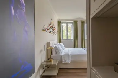 a bedroom with a bed and a window at Nine Athens Hotel in Athens