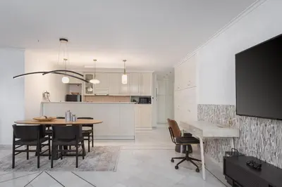 a kitchen and dining room with a table and chairs at Athenian Secret Glyfada in Athens
