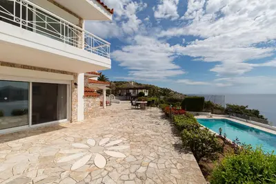 a villa with a swimming pool and the ocean at Villa Asossa with Private pool & Sea view in Dhaskalión