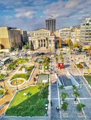 a view of a city with buildings and a park at ROYAL BLUE GRAND Suite No 4 Piraeus Port in Piraeus
