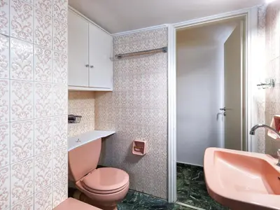 a bathroom with a pink toilet and a sink at Central Pagrati Apartment with Park View Balcony - opp Pangrati Grove in Athens