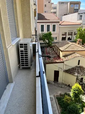 an apartment balcony with an air conditioner on a building at Central44 Luxury Apartment Ermou in Athens
