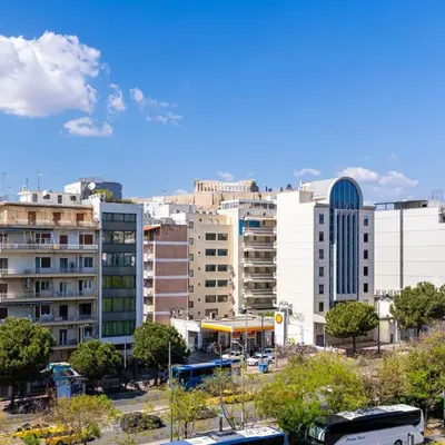 a view of a city with buildings and buses at Parthenon view luxury penthouse in Athens