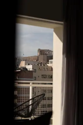 a view of a city from a window at Parthenon view luxury penthouse in Athens