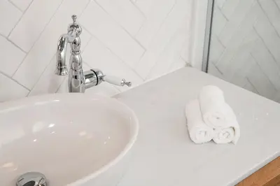 a bathroom with a sink and a towel at DIOS Zeus Temple View 1 Bedroom Apartment in Athens